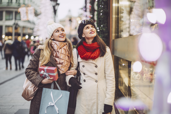 Young women are shopping together for Christmas